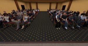 A large hotel type meeting room filled with an unmanagable audience.